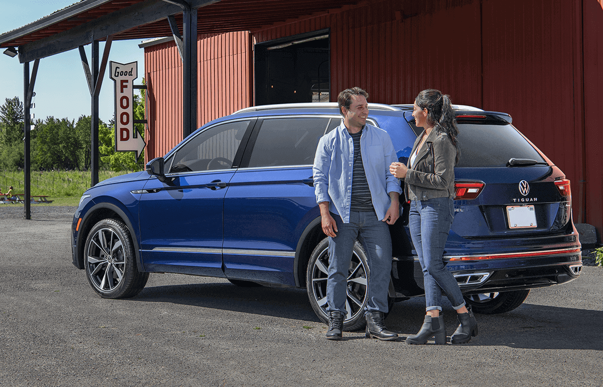 An Atlas is parked in the driveway of a home.