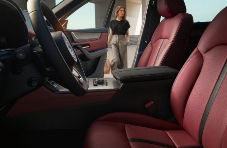 side view of the front row seating and steering wheel in the 2025 Mazda CX-70