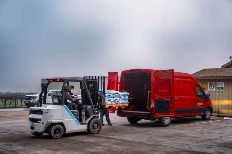A 2026 Ford E-Transit cargo van upfitted for taking on heavy loads