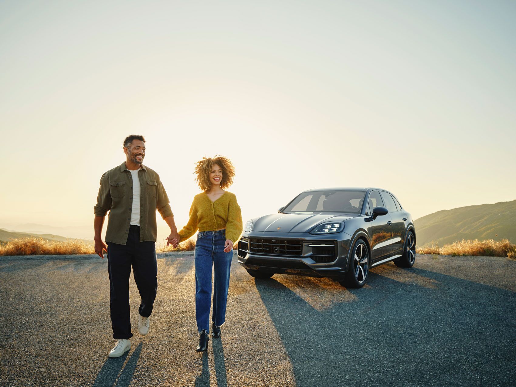 A couple sitting in a Porsche in ,
