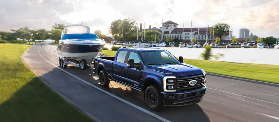 A Ford Super Duty truck towing a large boat