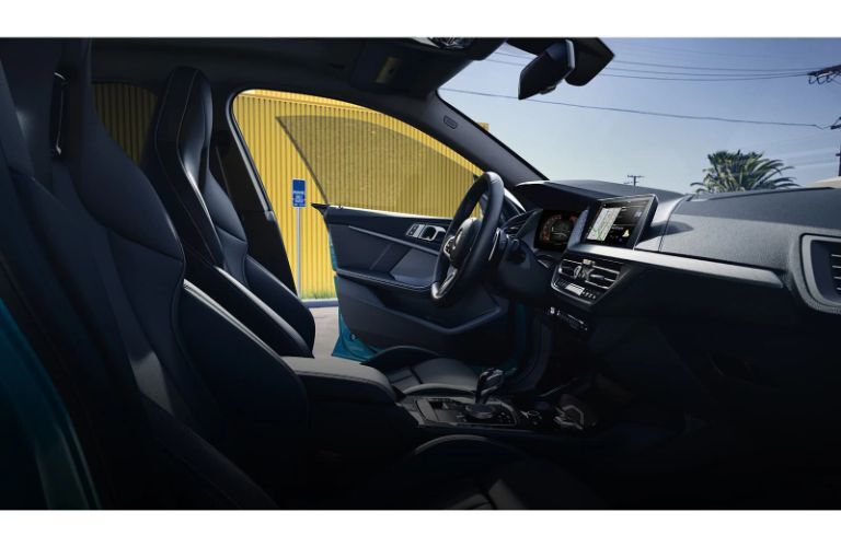 2020 BMW 228i interior showing front cabin through passenger doors