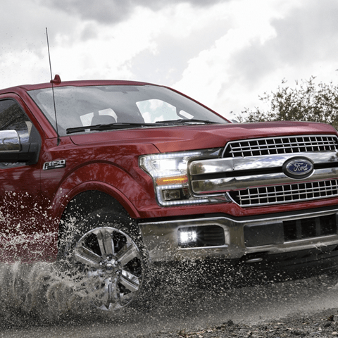 ford truck going through the mud