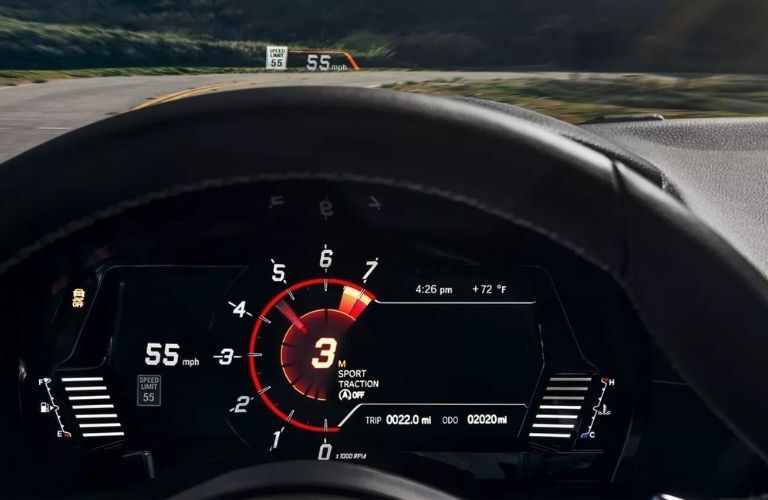 View of the 2023 Toyota GR Supra steering wheel, instrument cluster, and HUD