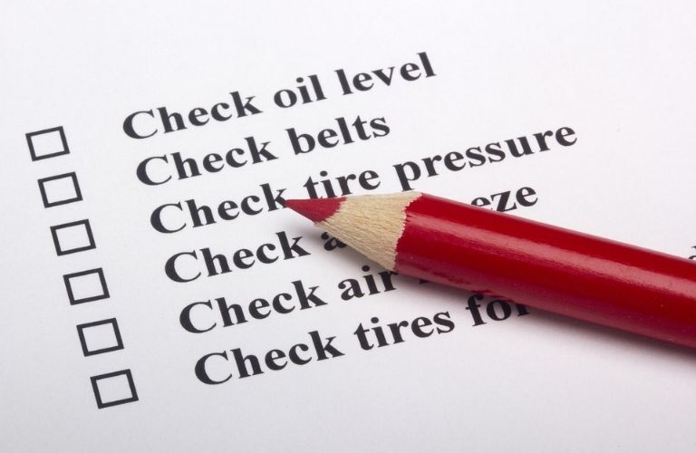 car inspection checklist with a red pencil
