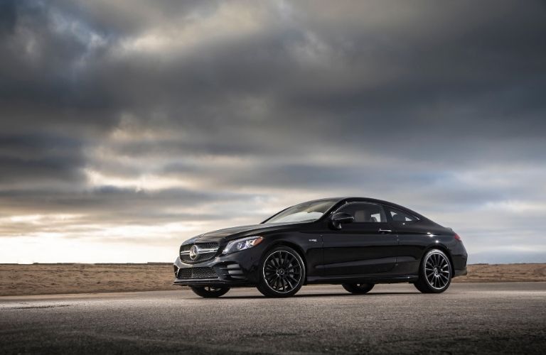 2021 MB C-Class Coupe exterior front fascia driver side with cloudy sky