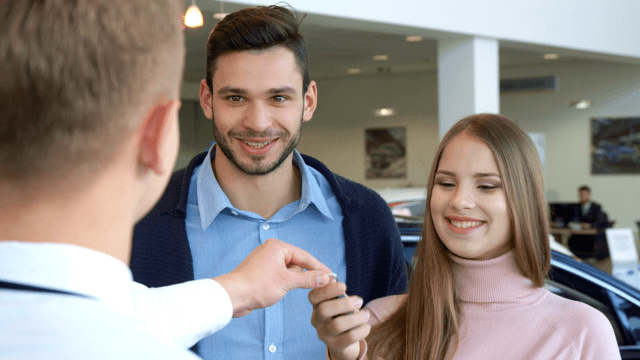 Salesman going through paperwork with a woman