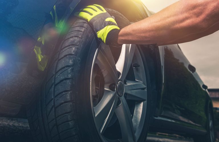 a technician fixing a tire
