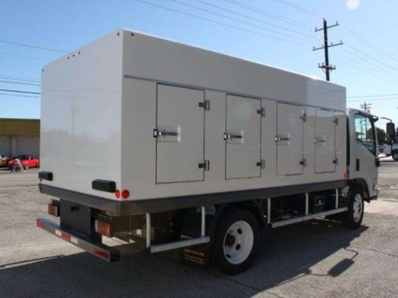 A rear quarter view of an Isuzu fridge truck