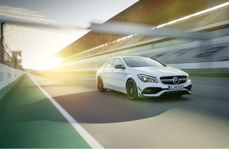 2017 Mercedes-Benz CLA on a race track driving at sunrise
