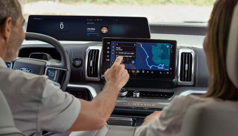 A man using the large infotainment screen in the 2025 Ford Expedition Active.