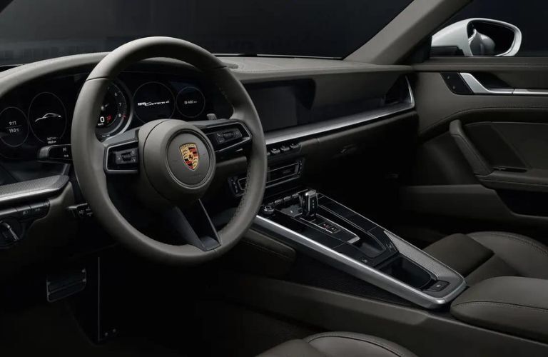The steering wheel of the 2022 Porsche 911 is shown.