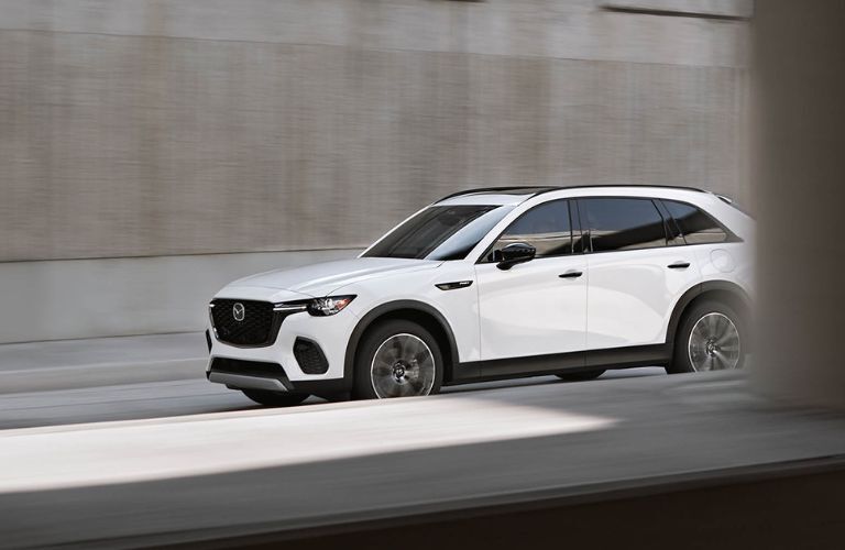 side view of the 2025 Mazda CX-70 PHEV on the road