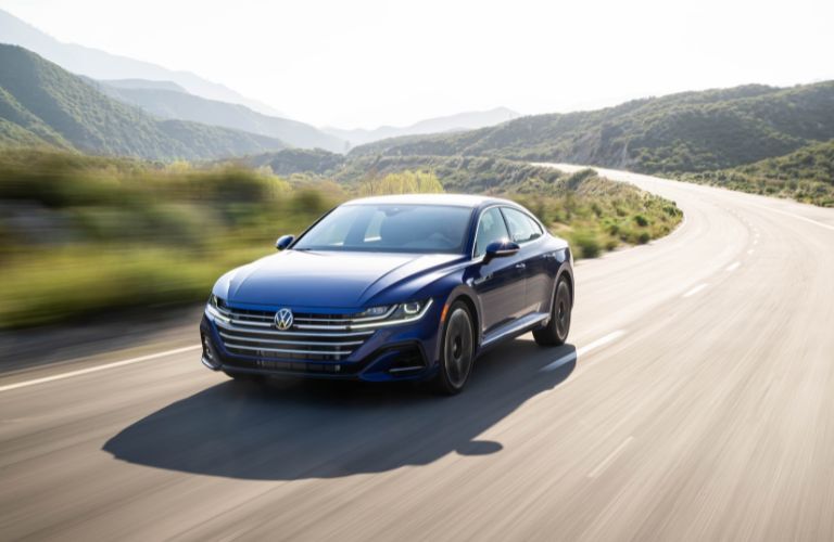 A 2023 Volkswagen Arteon speeding on a road