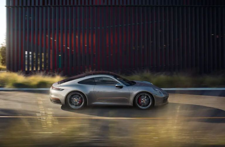 The 2023 Porsche 911 Carrera speeding on the road