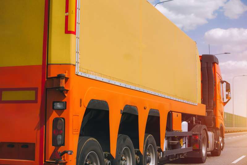 A semi truck driving on a highway