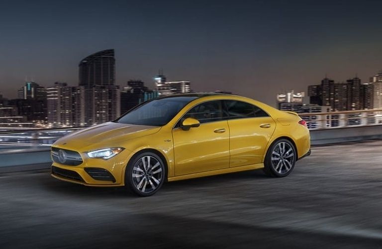 2022 Mercedes-AMG CLA 35 in yellow parked in urban background