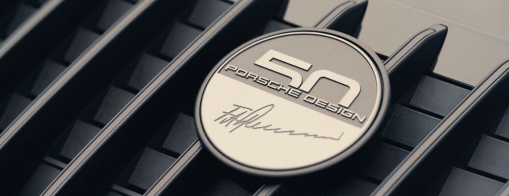 Porsche design written on a metallic badge