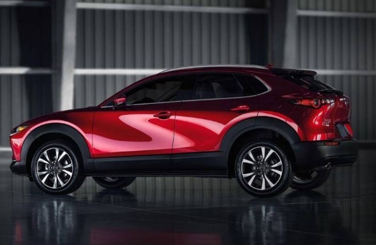 side view image of Mazda CX-3 parked in a garage