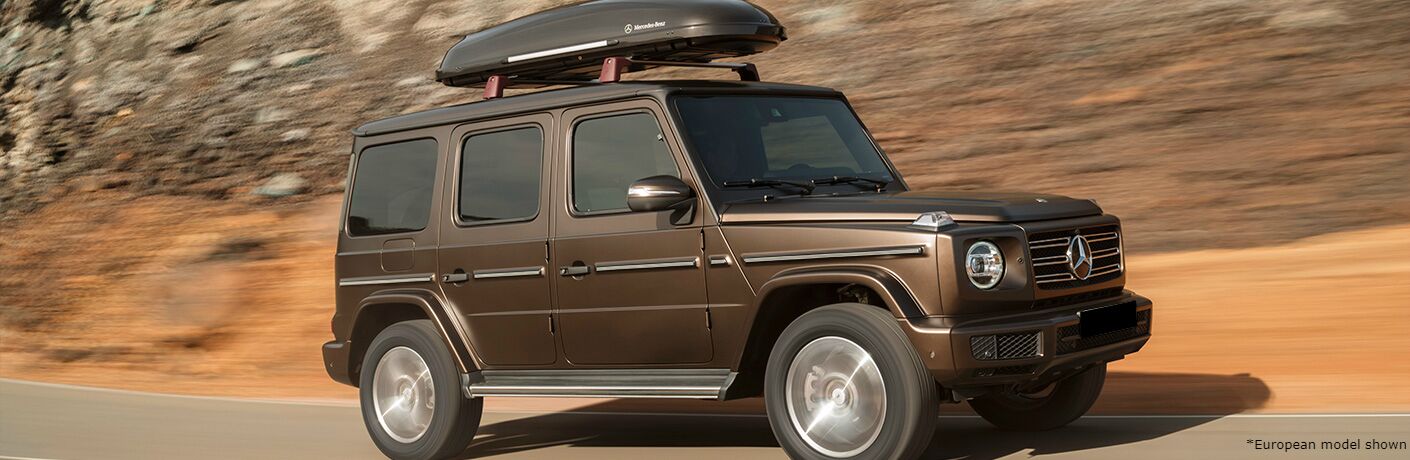 2020 MB G-Class exterior front fascia passenger side on highway with blurred cliff