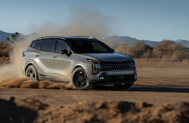 2026 Kia Sportage driving in sand