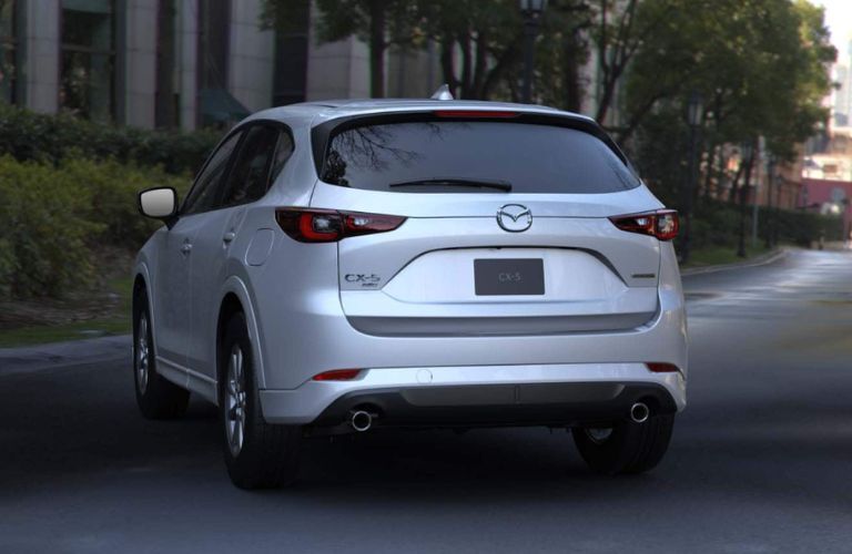 2024 Mazda CX-5 2.5 S Select rear view on the road