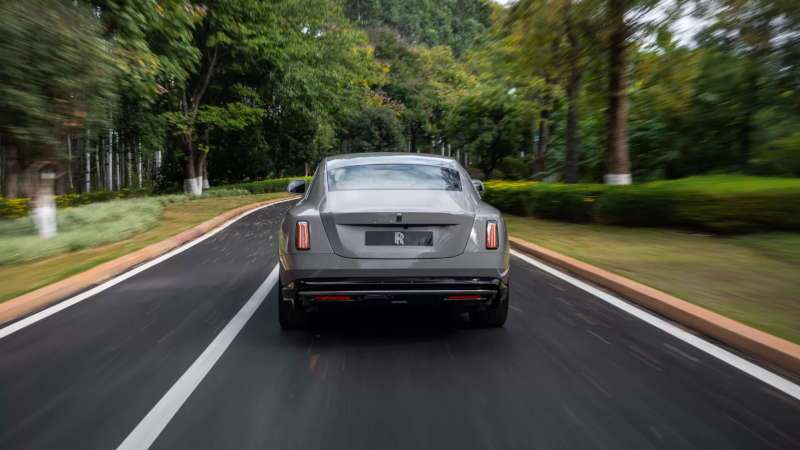 A rear exterior view of the 2025 Rolls-Royce Spectre