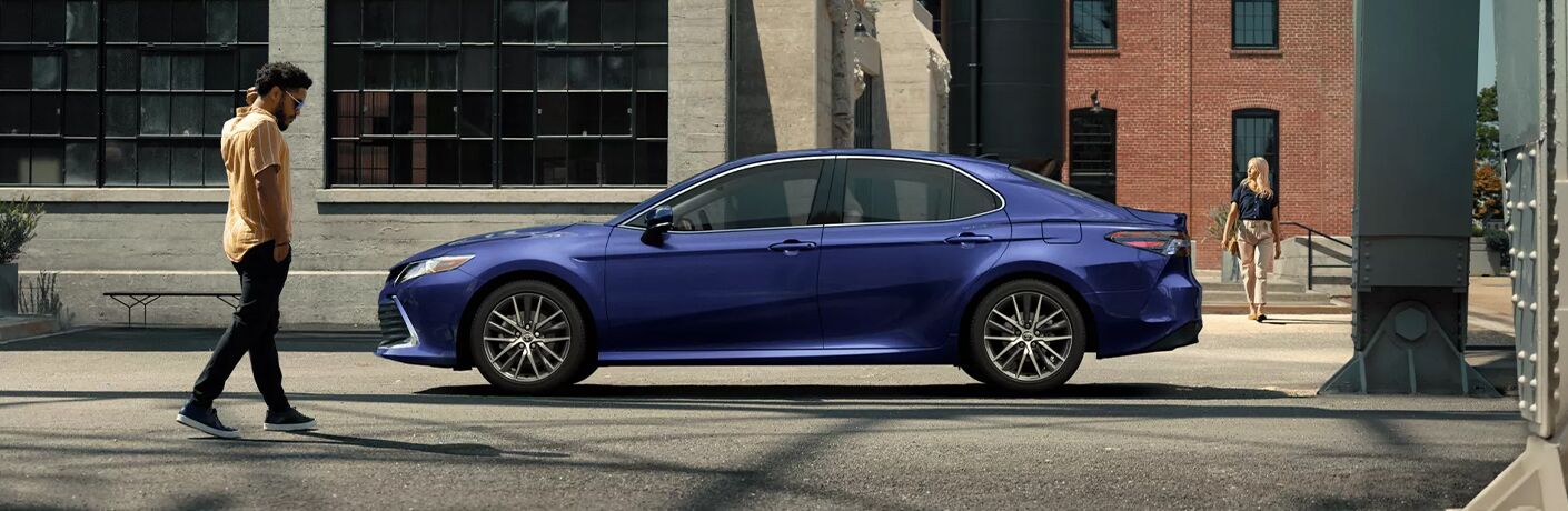 2022 Toyota Camry side view in a city