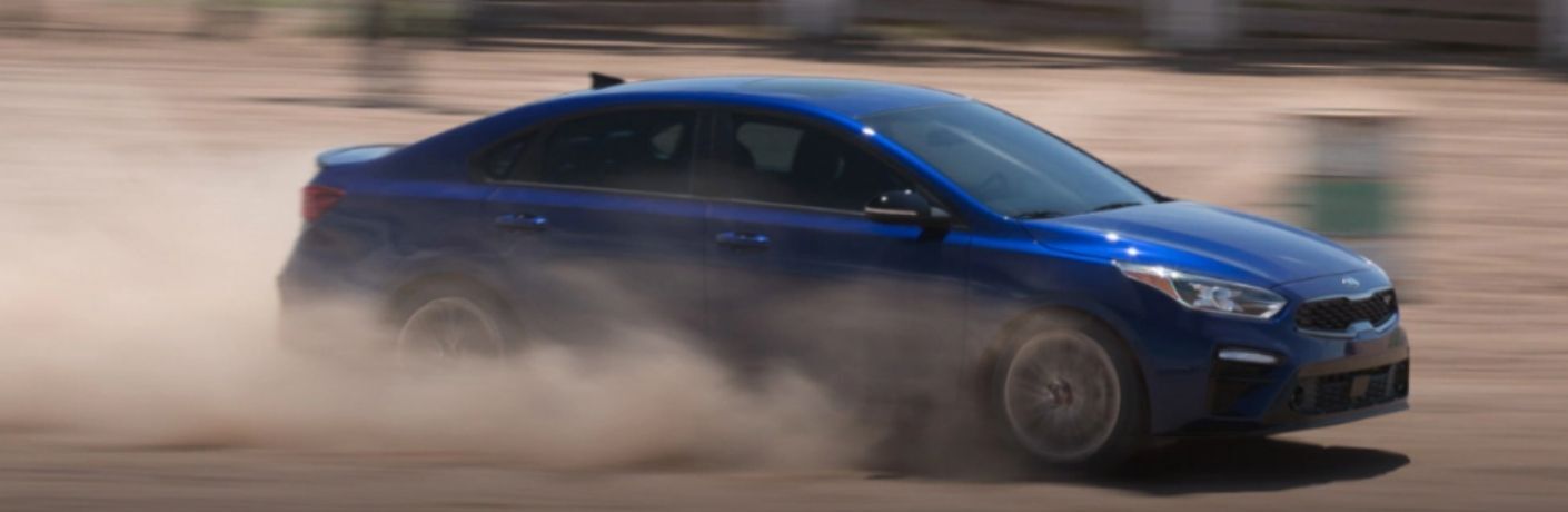 2021 Kia Forte driving on sand