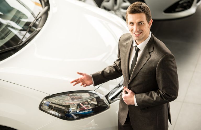 a sales personnel at a car dealership