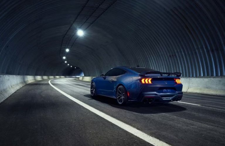 2025 Ford Mustang rear view on a night road