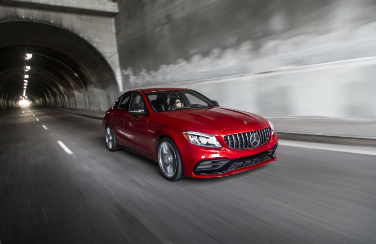 2018 MB C-Class exterior front fascia and passenger side going fast through tunnel