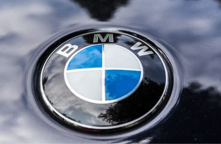 Close up of the BMW logo in a car is shown