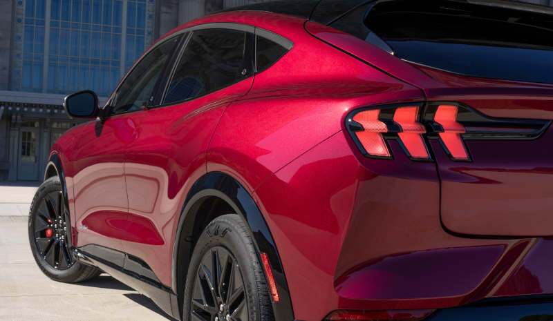A rear quarter view showcasing the clean lines and aggressive styling of the 2025 Ford Mustang Mach-E.