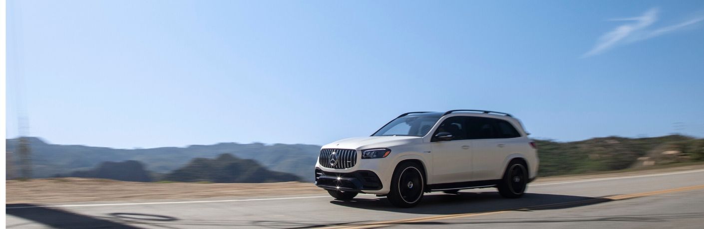 2021 MB GLS exteiror front fascia driver side on blurred highway with blue sky