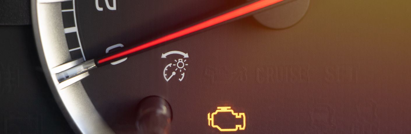 a warning light glowing on a vehicle's dashboard
