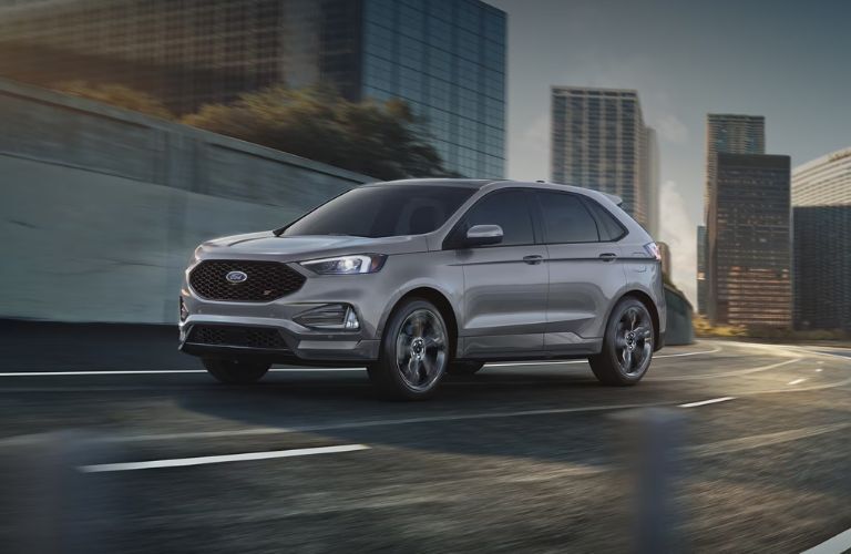 A 2024 Ford Edge taking a turn on a road