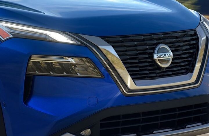 Front grille of a blue 2022 Nissan Rogue_o