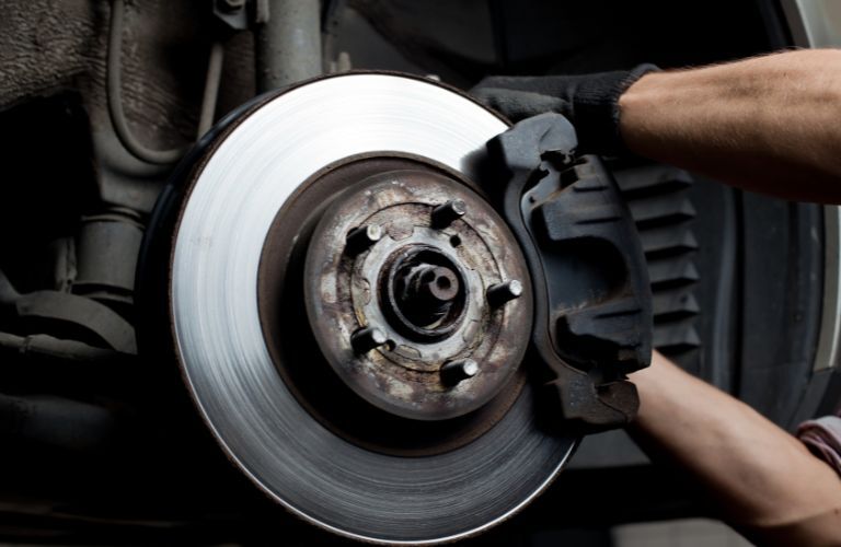 brake pad replacement being undertaken in a car