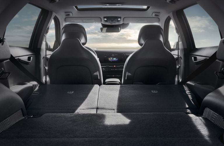 rear view image of the inside of the cargo bay and cabin of the 2025 Kia Niro Hybrid