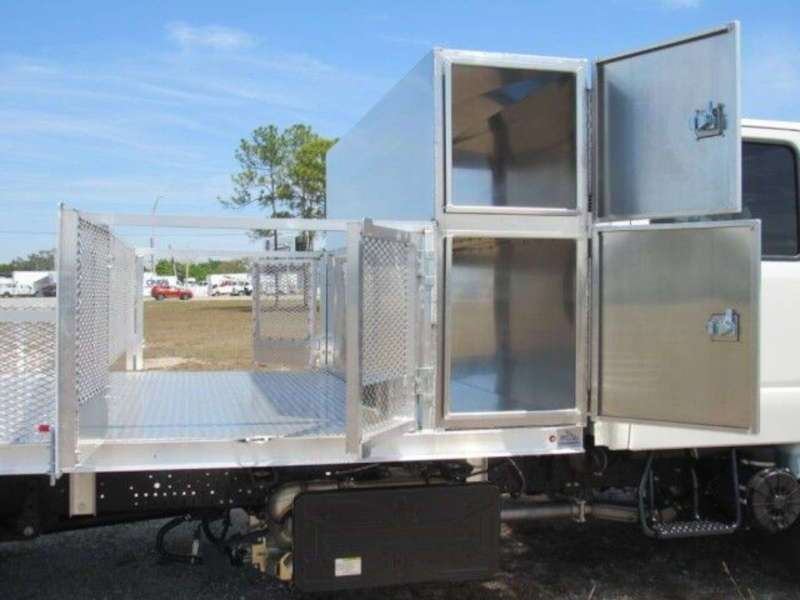 Compartments for tools on a flatbed landscaping truck