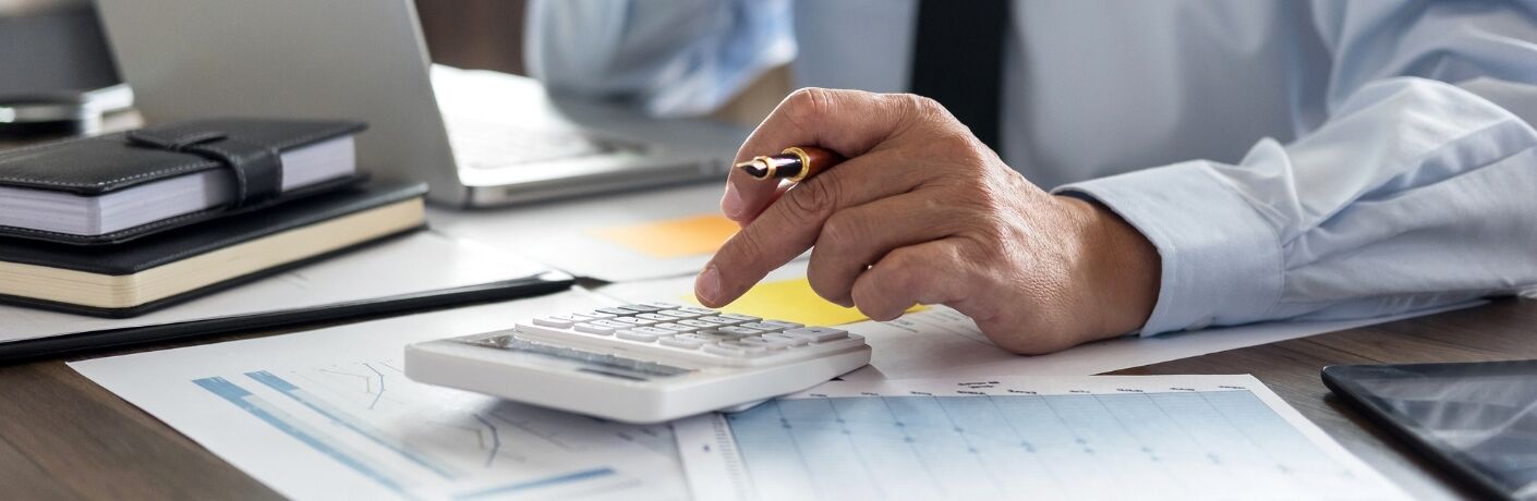 Closeup of individual calculating finances