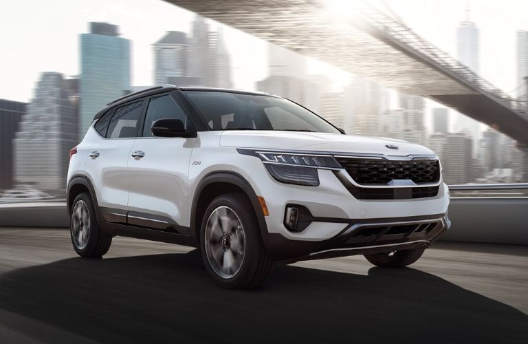 2021 Kia Seltos driving under city bridge