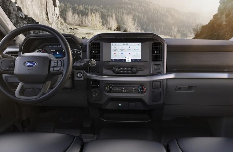 The interior steering wheel area of the 2023 Ford F-150 is shown.
