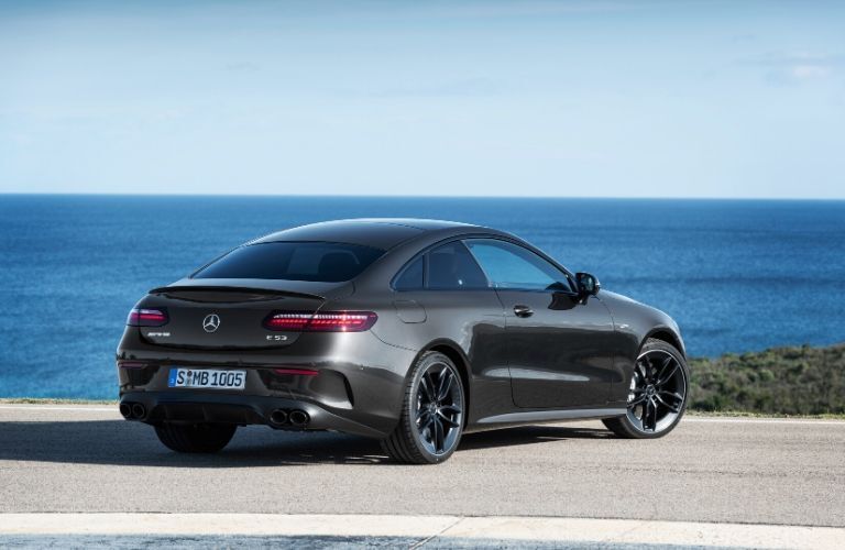 2021 MB E-Class Coupe exterior front fascia passenger side in front of ocean