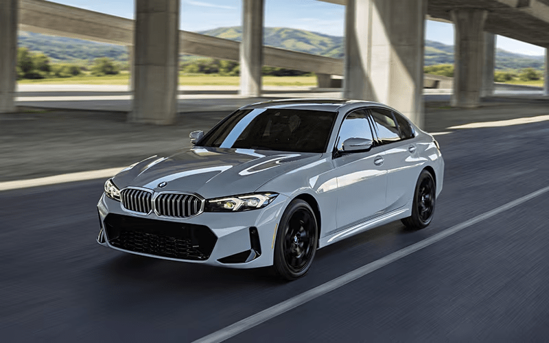 2026 BMW 3 Series driving under overpass front-view