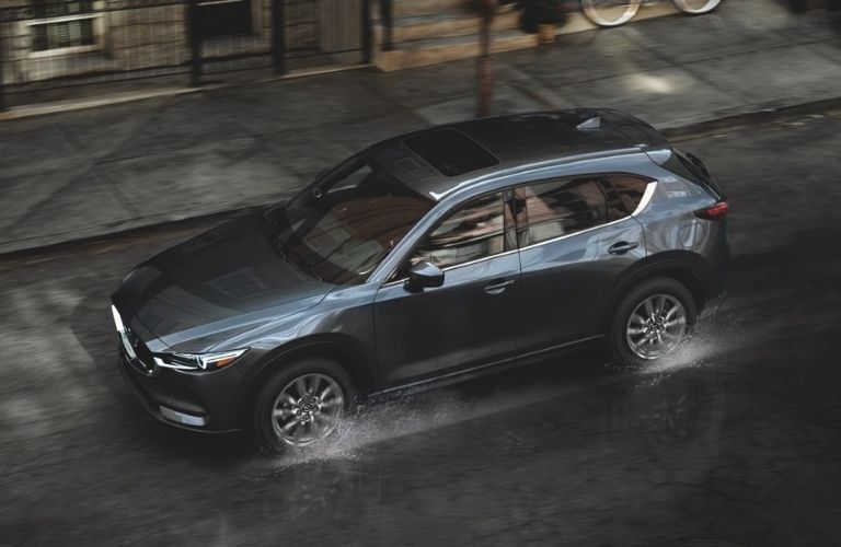 Mazda SUV on a wet road