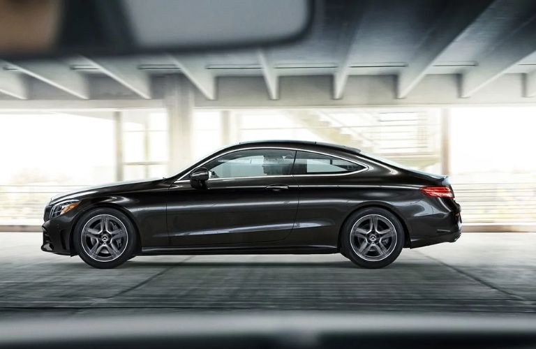 Side view of the 2023 Mercedes-Benz C-Class Coupe driving