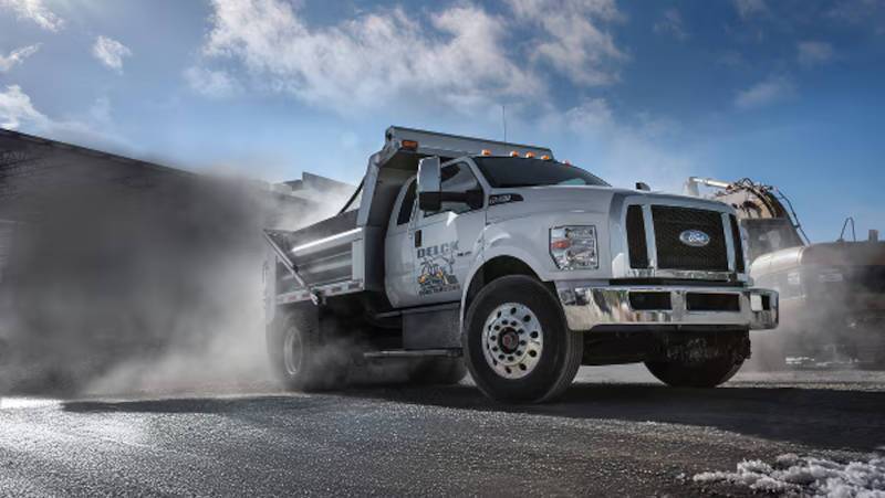 A commercial upfit Ford work truck in dump truck configuration