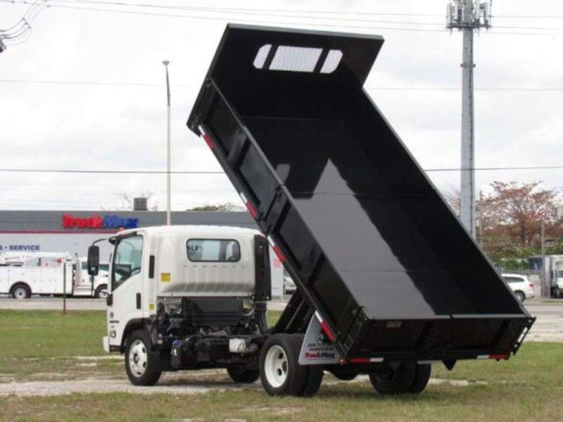 A rear quarter view of an Isuzu rolloff truck